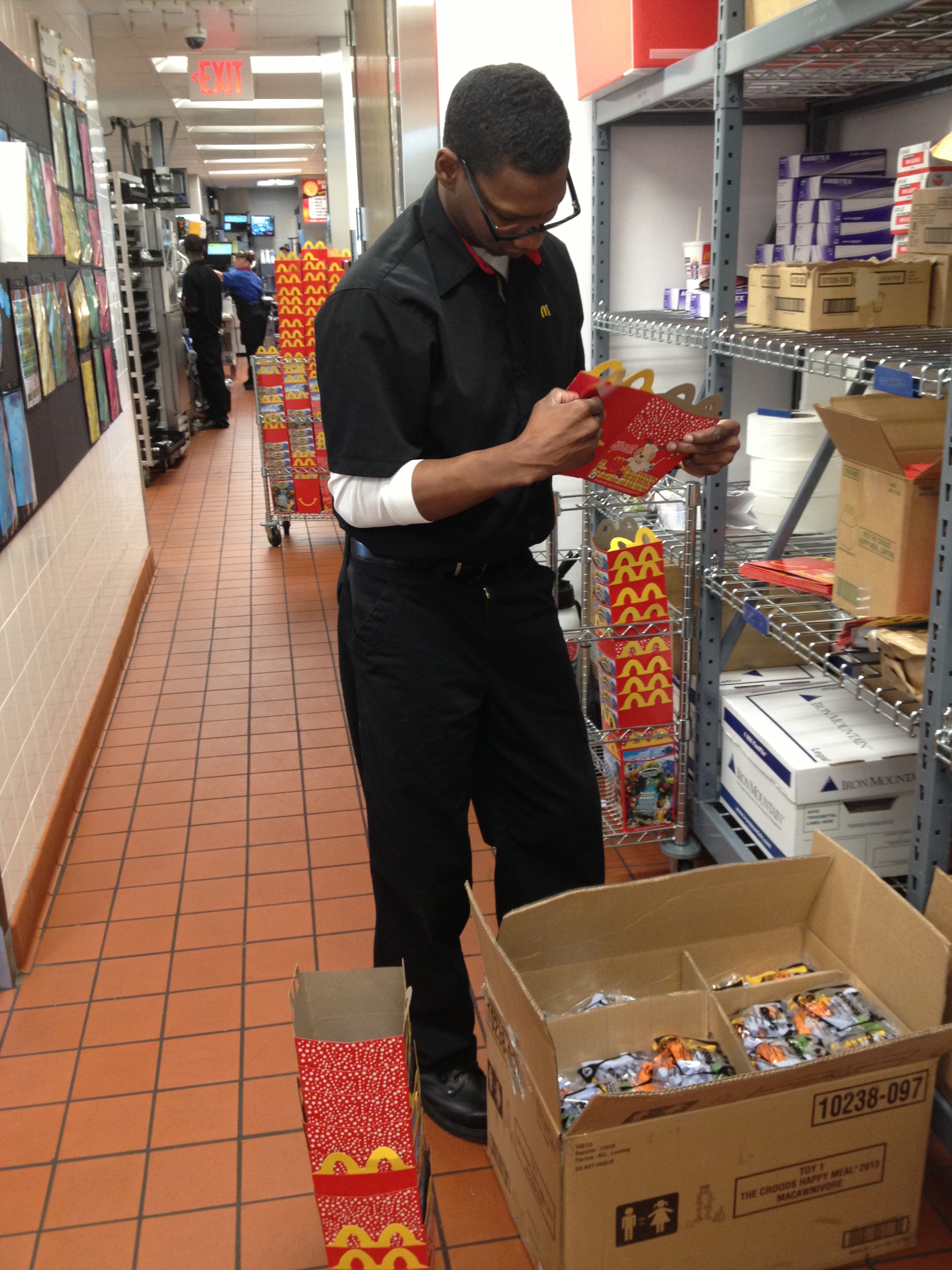 Keith unpacking happy meal boxes.