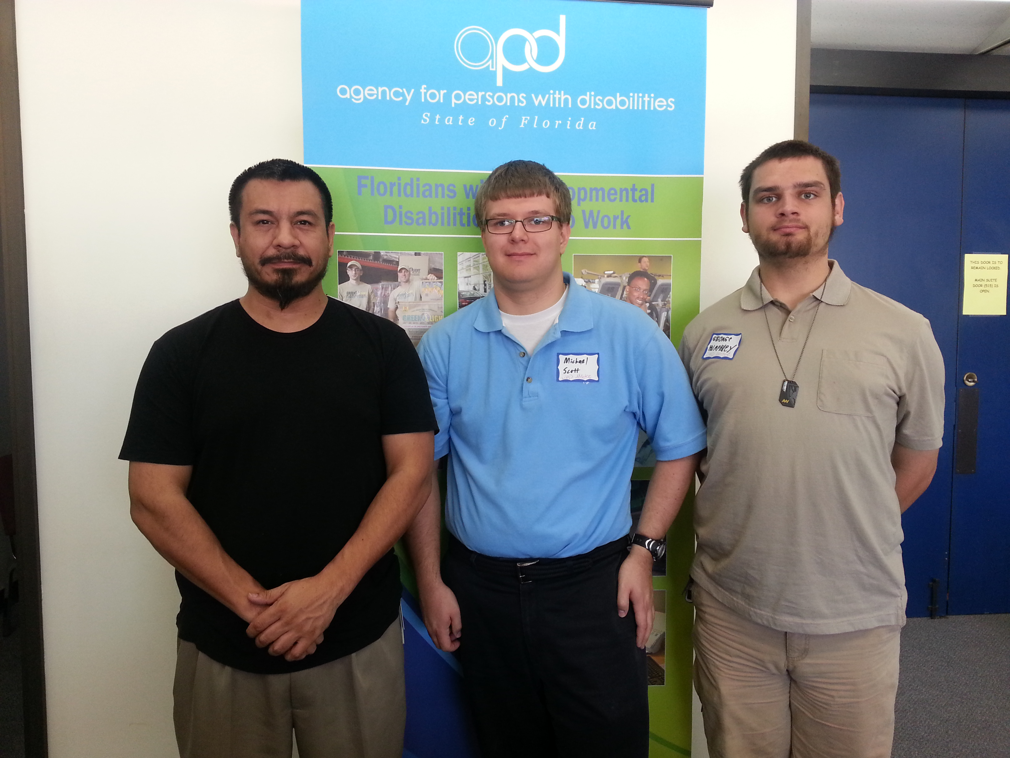 APD employee Mike Fuentes with mentees Michael Scott and George Humphrey.
