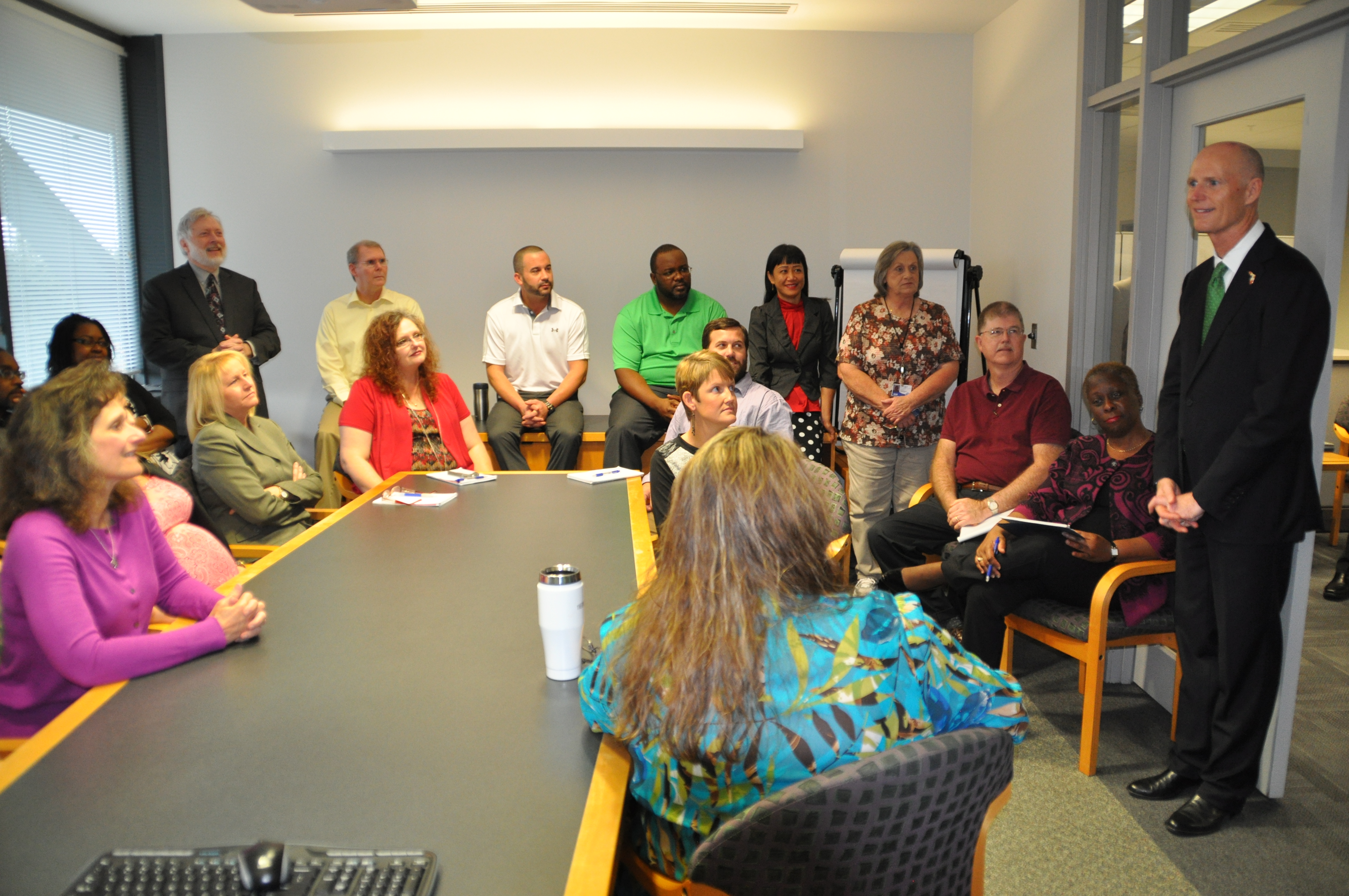 Governor Scott visits with some of the APD State Office staff.