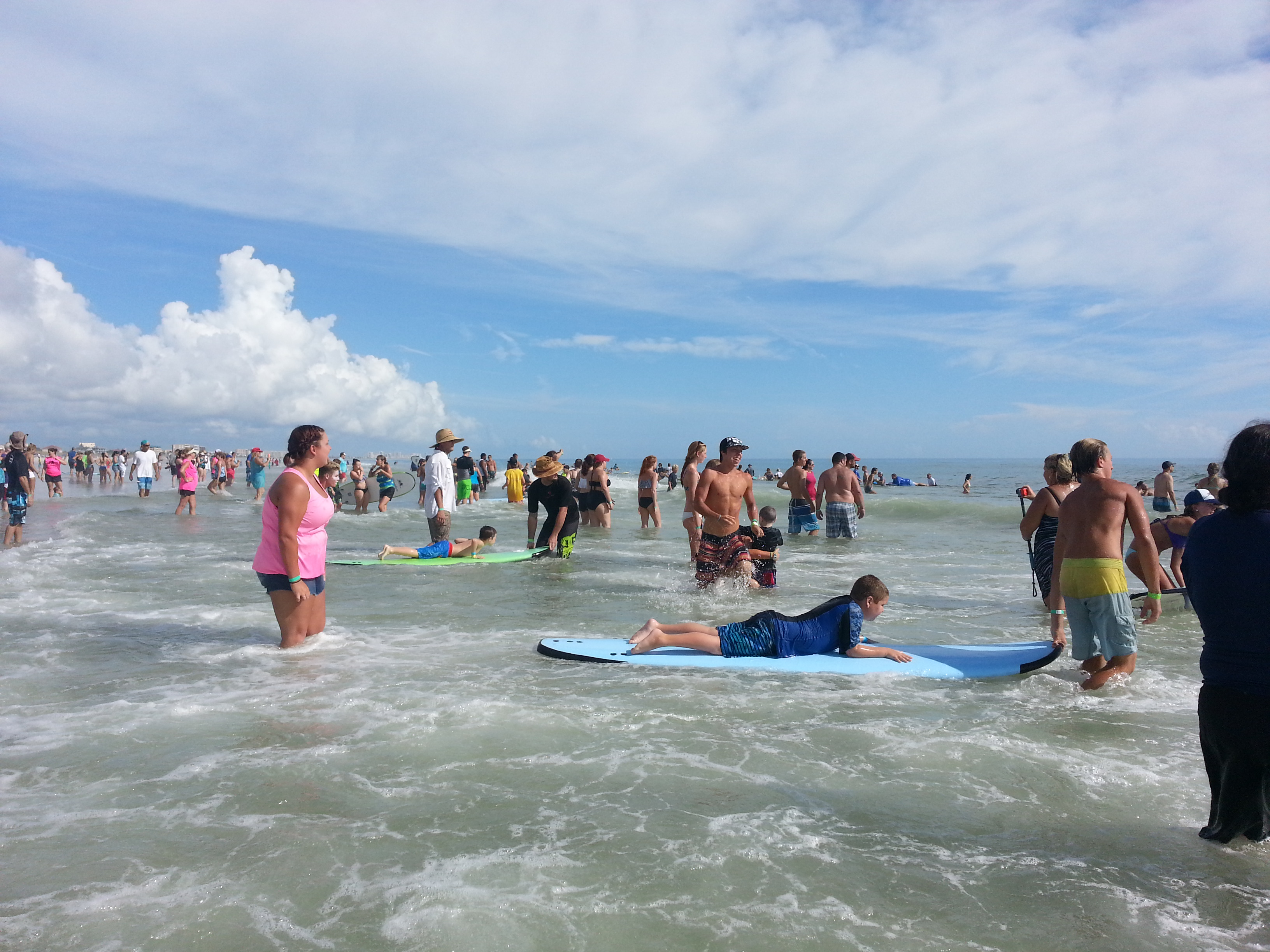 Everyone paddling out hoping to catch some waves.
